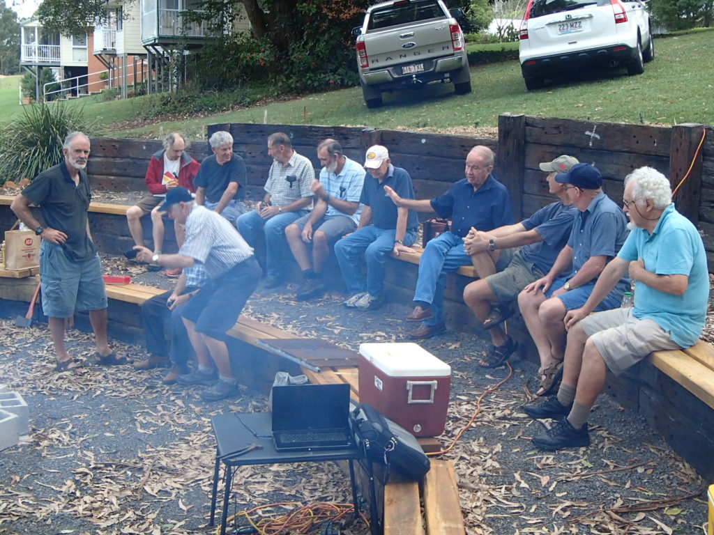 Photo of Band of Broters enjoing a BBQ at the Amphitheatre at the church